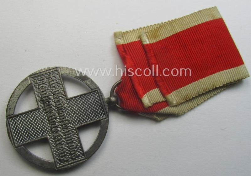 'DRK-Ehrenzeichen des 3. Modell' that comes together with its original (regular-sized- and period-mounted) ribbon (ie. 'Bandabschnitt') as issued and/or stored for decades — image 3