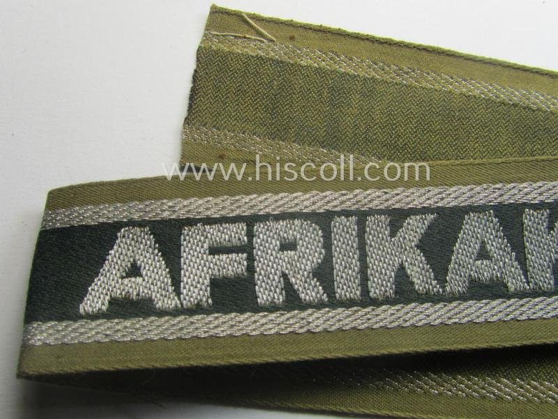 'BeVo'-like cuff-title (ie. 'Ärmelstreifen') entitled: 'Afrikakorps' being a presumably issued but simply never worn example that comes in an overall very nice- (ie. non-shortened- and never tunic-attached-), condition — image 2