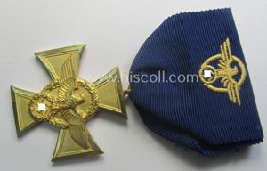 Golden-class 'Pol.-Dienstauszeichnung 1. Stufe' (or: police loyal-service medal first-class) that …