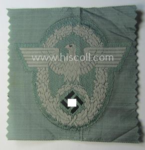 Police- (ie. 'Polizei'-) related armbadge (ie. arm-eagle) being a typical …