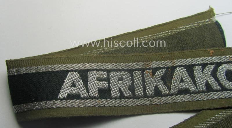 'BeVo'-like cuff-title (ie. 'Ärmelstreifen') entitled: 'Afrikakorps' being a presumably issued but simply never worn example that comes in an overall very nice- (ie. non-shortened- and never tunic-attached-), condition — image 2