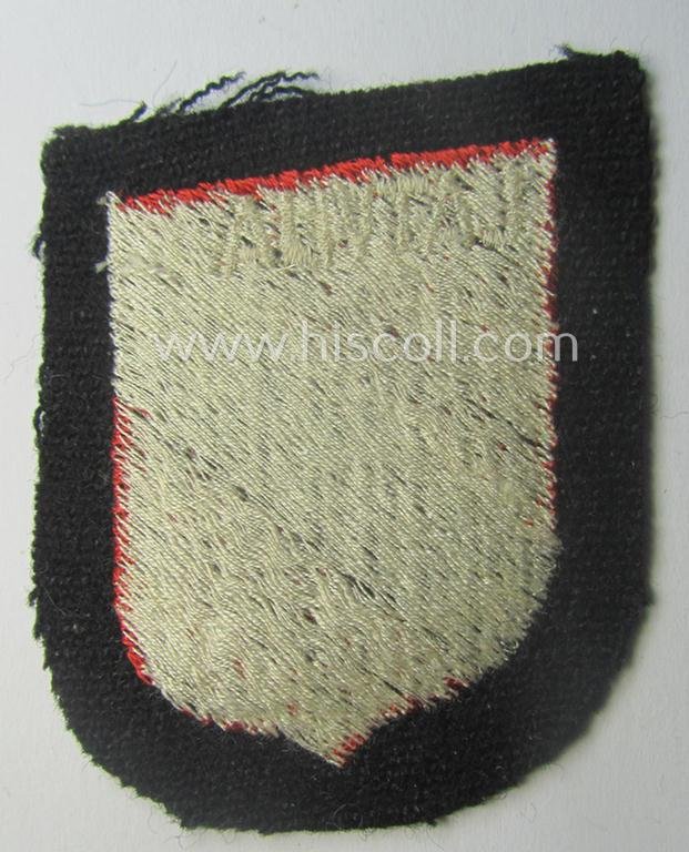 Waffen-SS 'volunteer'-arm-shield as was intended for usage by soldiers of the: '15. o. 19. Waffen-Grenadier-Division der SS' (ie. 'lettische nr. 1 o. 2') and that comes in a 'virtually mint- ie. unissued', condition — image 2