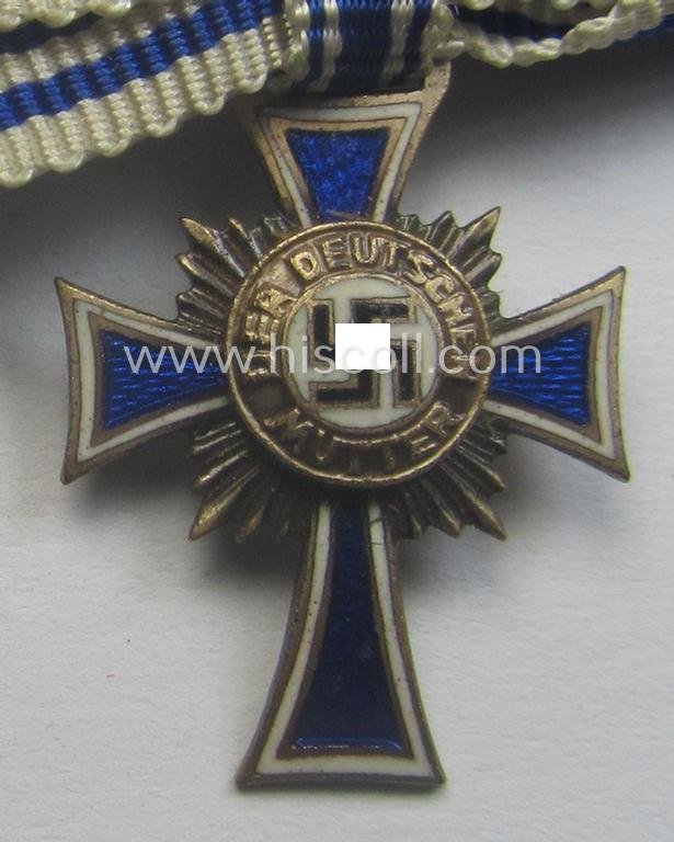 Miniature of an: 'Ehrenkreuz der deutschen Mutter - zweite Stufe' (or: silver-class mothers'-cross) being a non-maker-marked example that comes in an overall nice- (albeit moderately worn- ie. used-), condition — image 3