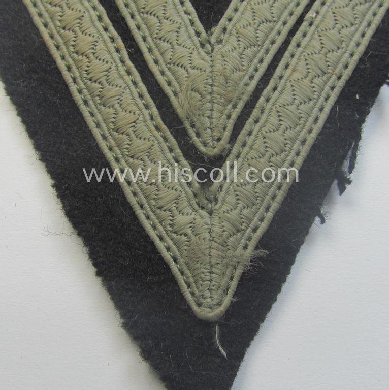 Truly used- and/or tunic-removed, Waffen-SS- (ie. Heeres Panzer-) type 'Armwinkel' (or: rank-chevron) as executed on black-coloured wool as was intended for an: 'SS-Rottenführer' (ie. 'Obergefreiter') — image 2