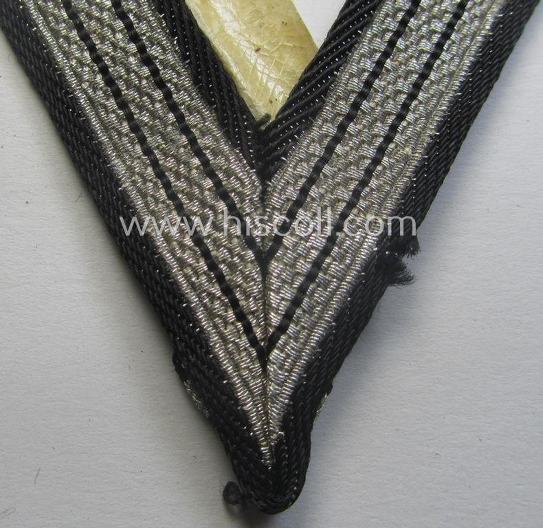 SS (ie. 'Allgemeine o. Waffen-SS') arm-insignia being an 'SS', so-called: 'Ehrenwinkel für Altgediente Kämpfer o. Angehörigen der SS' (or: honorary-chevron for old campaigners) still retaining its period 'RzM'-etiket — image 4