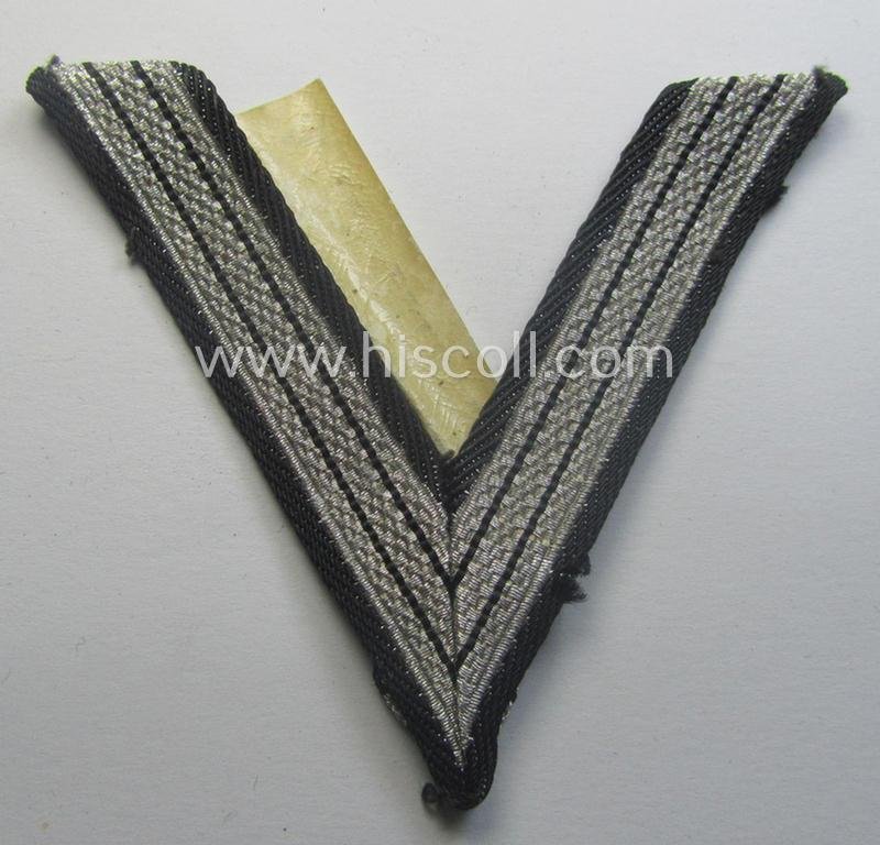 SS (ie. 'Allgemeine o. Waffen-SS') arm-insignia being an 'SS', so-called: 'Ehrenwinkel für Altgediente Kämpfer o. Angehörigen der SS' (or: honorary-chevron for old campaigners) still retaining its period 'RzM'-etiket — image 5