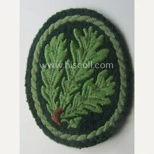 Truly used WH (Heeres) so-called: 'Jäger'-armbadge being a neatly machine-embroidered- …