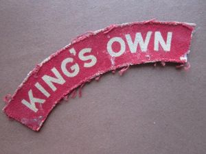 A nice issued King's Own white on red printed clorh …