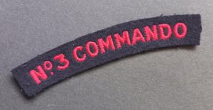 A nice un-issued red on black embroided - regrettably single …