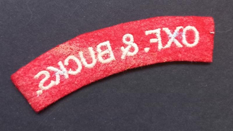 A attractive - albeit regrettably single - un-issued embroided Oxf.& Bucks. (Oxfordshire and Buckinghamshire Light Infantry) shoulder title — image 2