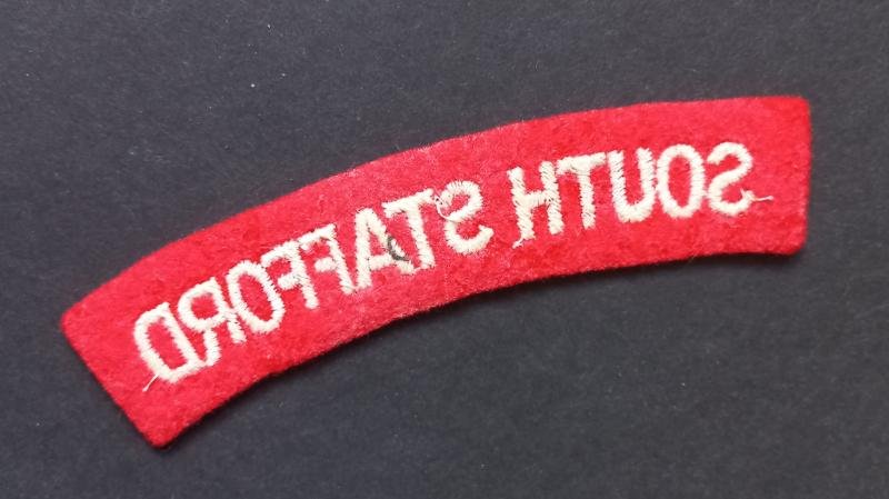 A neat un-issued (white on red) embroided South Stafford shoulder title — image 2