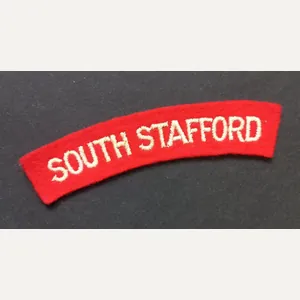 A neat un-issued (white on red) embroided South Stafford shoulder …