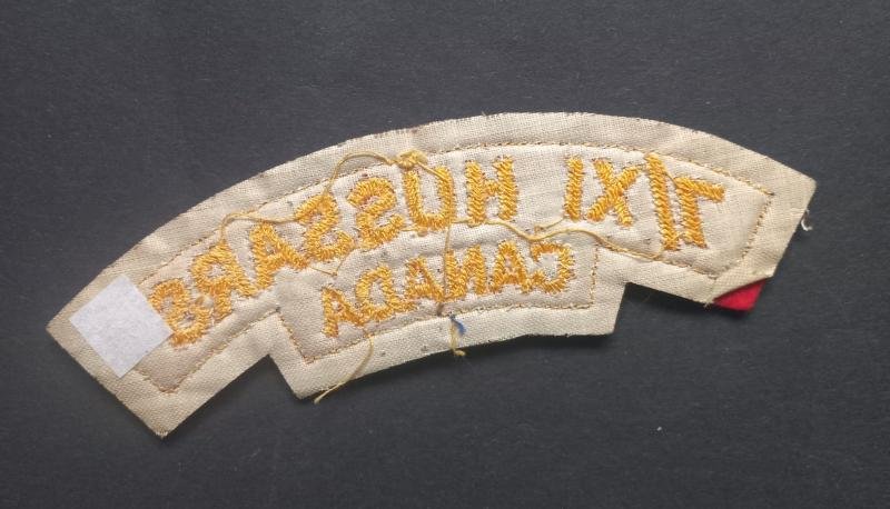 A nice un-issued British made (white backing) Canadian 7th/XI Hussars Regiment of Canada 11th VII Cloth shoulder title — image 2