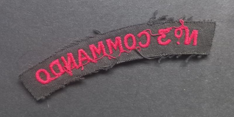 A nice un-issued red on black embroided - regrettably single - Number 3 Commando shoulder title — image 2