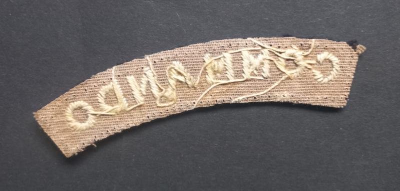 A superb - albeit regrettably single - early white on black embroided commando shoulder title — image 2