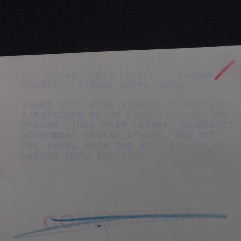 A attractive official US Signal Corps 'Press Release' (large 25.9cm x 20.2cm) photograph showing British S.A.S. (Special Air Service) troops after Operation HAFT meeting up with American troops some were in France — image 3