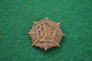 R.L.B. cap badge.