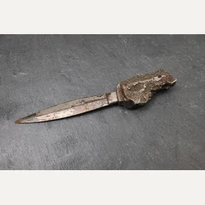 letter opener made from bomb shrapnel