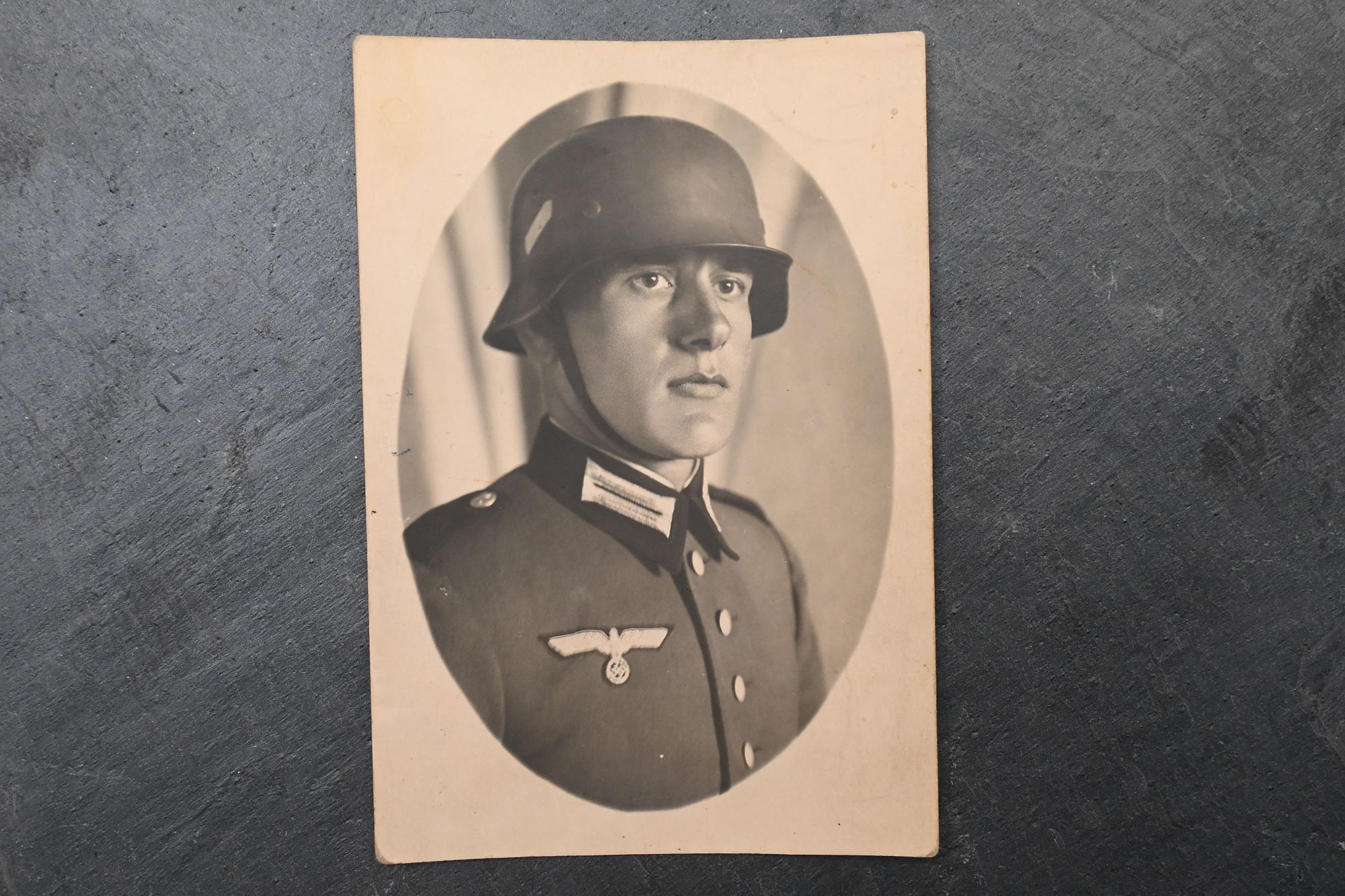 postcard of a Wehmacht soldier with a helmet