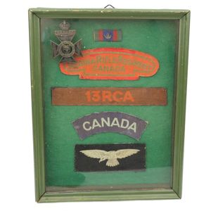 Small collection of framed Canadian Insignia
