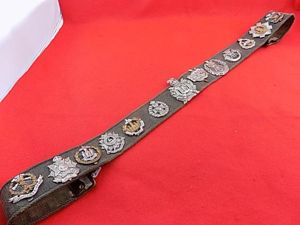 37 Pattern belt with 13 badges attached