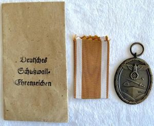 WW2 GERMAN WEST WALL MEDAL AND PACKET - UNISSUED