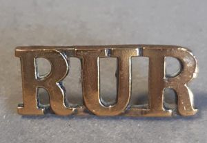 BRITISH Shoulder Title “R.U.R” (Royal Ulster Rifles)– Gilding Metal