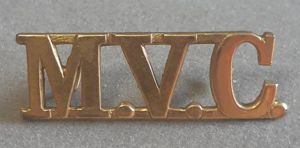 'M.V.C.' (MALACCA VOLUNTEER CORPS – 1922-1942) Brass Shoulder Title