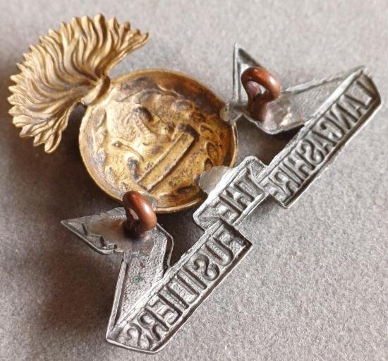 BRITISH - Lancashire Fusiliers Bi-Metal (5/6/7/8 Territorial Battalions) Hat Badge (KK1716) — image 2