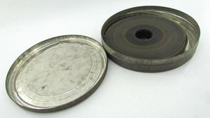 Large Film can with WWII 35mm film included