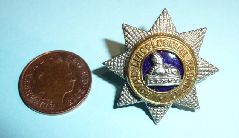 Royal Lincolnshire Regiment Officer's Small Silver Gilt and Enamel Field Service / Side Cap Badge — image 2