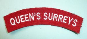 Queens Surreys Embroidered White on Red Felt Cloth Shoulder Title