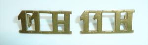 11th Hussars Pair of Brass Shoulder Titles
