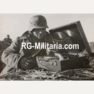 Original WW2 German Press Photo - German soldier listening to …