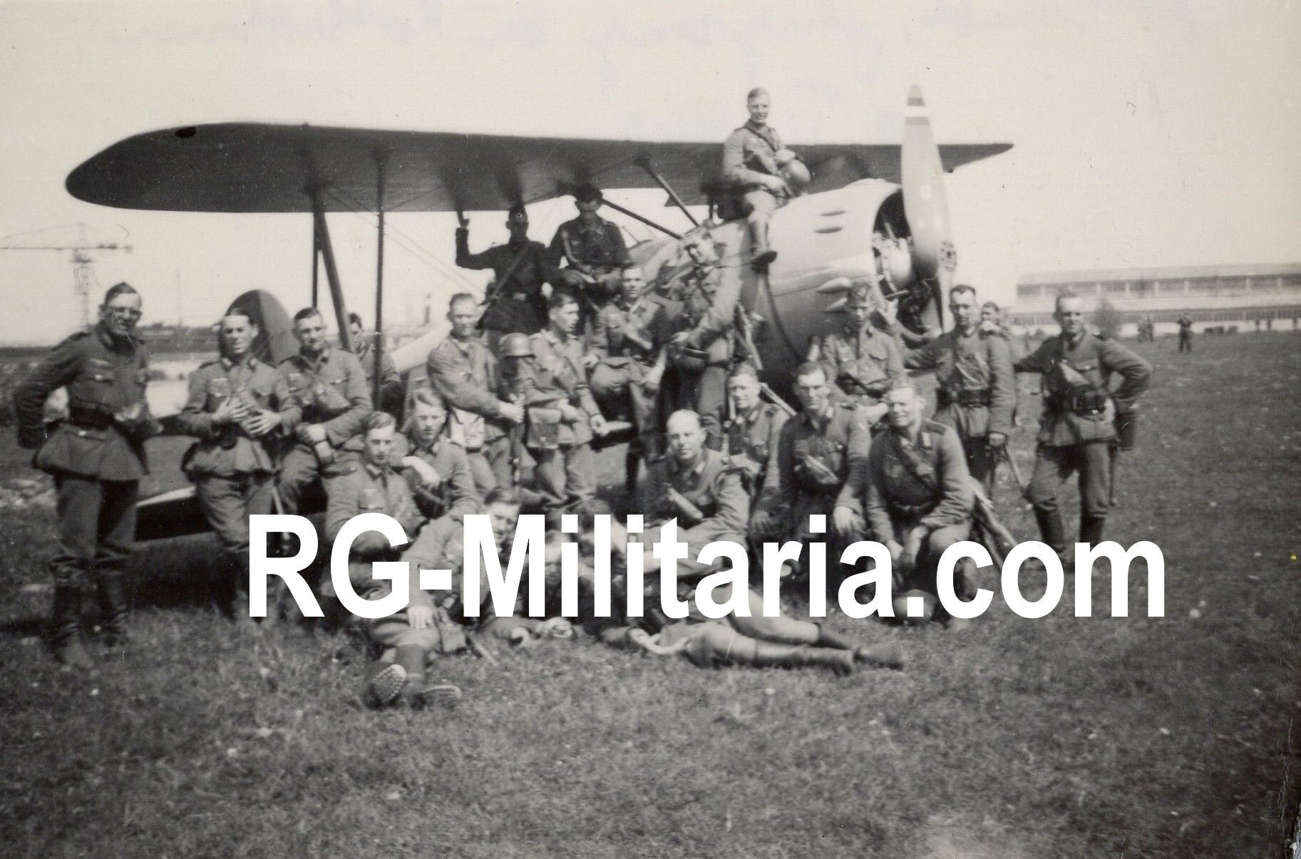 Original WW2 German Photo - German Wehrmacht soldiers in front of a Dutch LVA airplane Koolhoven FK51 at Waalhaven, Rotterdam airfield, Holland (1940)