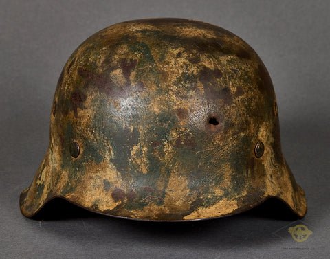 WWII German Model 1942 Camouflage Helmet with Battle Damage — image 2