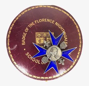 Florence Nightingale School of Nursing silver hospital badge & case