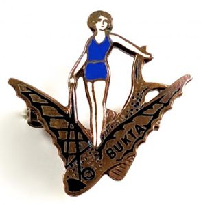 Bukta Swimwear bathing beauty poised on a flying fish promotional …