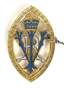 Queens Institute of District Nursing 21 years service badge