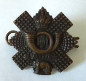 Highland Light Infantry Officer Brass Collar Badge with maker tablet