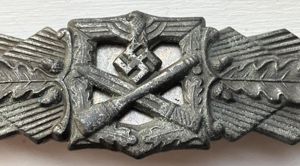 COMBAT CLASP IN BRONZE. BY FLL.