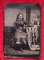 Tintype of Girl with Picture of her Family