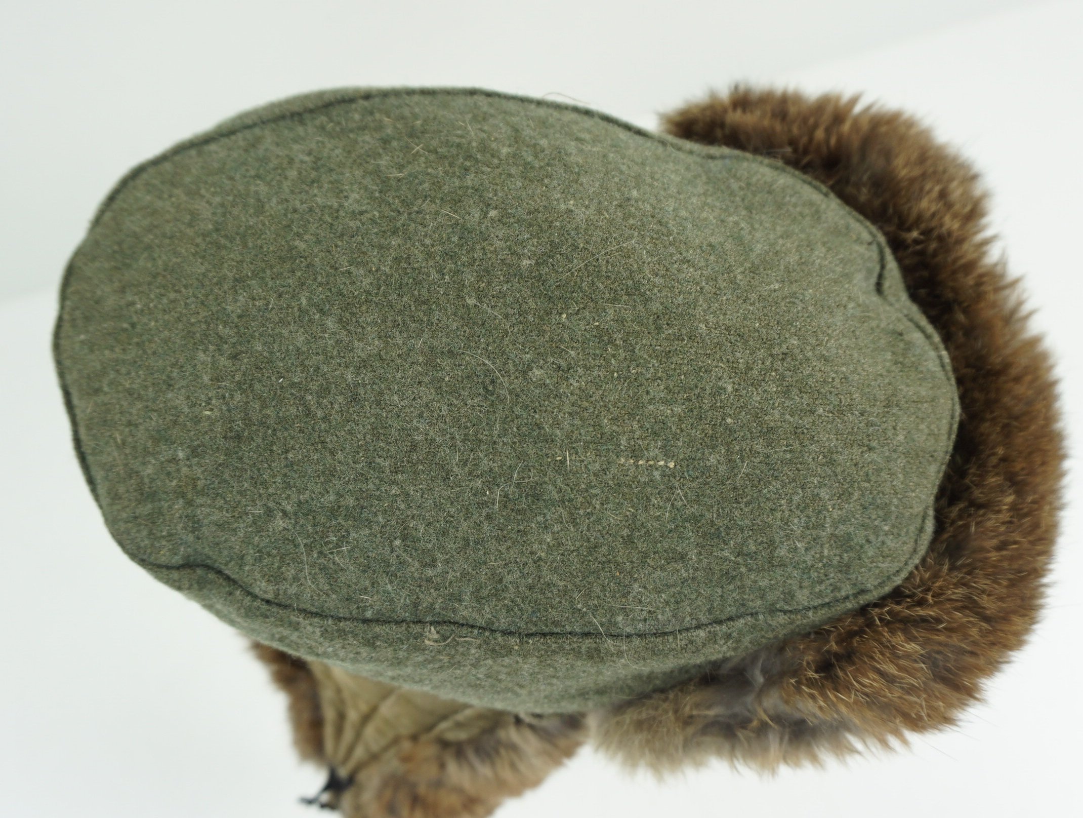 Wehrmacht Winter Fur Cap (Pelzmütze). With the orginal eagle . Size 55 and date 1943 — image 11