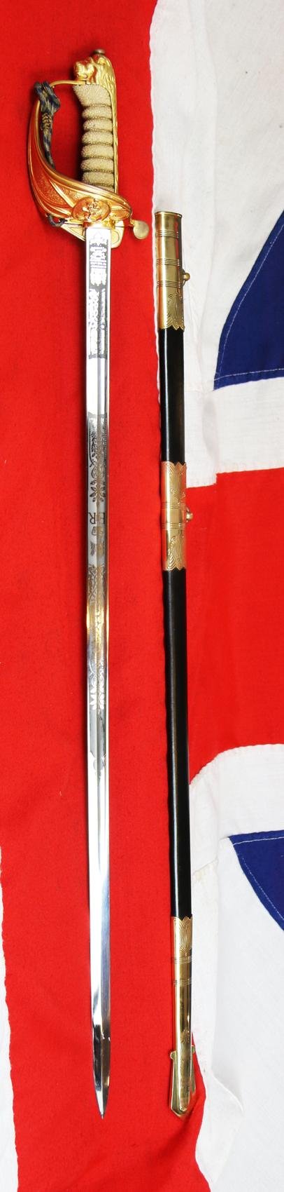 A Near Mint British Royal Naval Offcer's Sword King George VIth Hilt and Mounts With The Upgraded Wilkinson Sword 1952-53 Deluxe Elizabeth IInd Coronation Blade, Of Mirror Bright & Frosted Polish. With Original Geo VIth Sword Knot — image 2