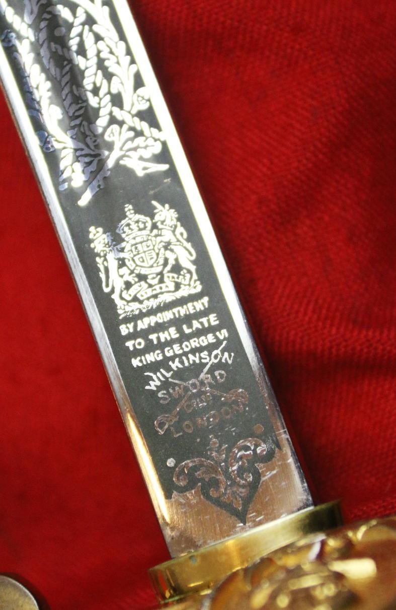 A Near Mint British Royal Naval Offcer's Sword King George VIth Hilt and Mounts With The Upgraded Wilkinson Sword 1952-53 Deluxe Elizabeth IInd Coronation Blade, Of Mirror Bright & Frosted Polish. With Original Geo VIth Sword Knot — image 4
