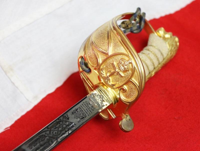A Near Mint British Royal Naval Offcer's Sword King George VIth Hilt and Mounts With The Upgraded Wilkinson Sword 1952-53 Deluxe Elizabeth IInd Coronation Blade, Of Mirror Bright & Frosted Polish. With Original Geo VIth Sword Knot — image 6