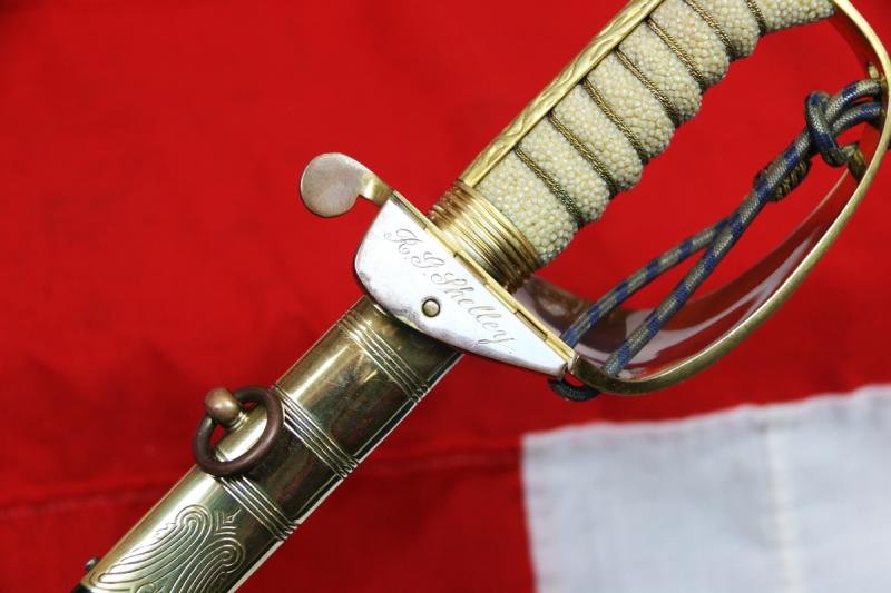 A Near Mint British Royal Naval Offcer's Sword King George VIth Hilt and Mounts With The Upgraded Wilkinson Sword 1952-53 Deluxe Elizabeth IInd Coronation Blade, Of Mirror Bright & Frosted Polish. With Original Geo VIth Sword Knot — image 7