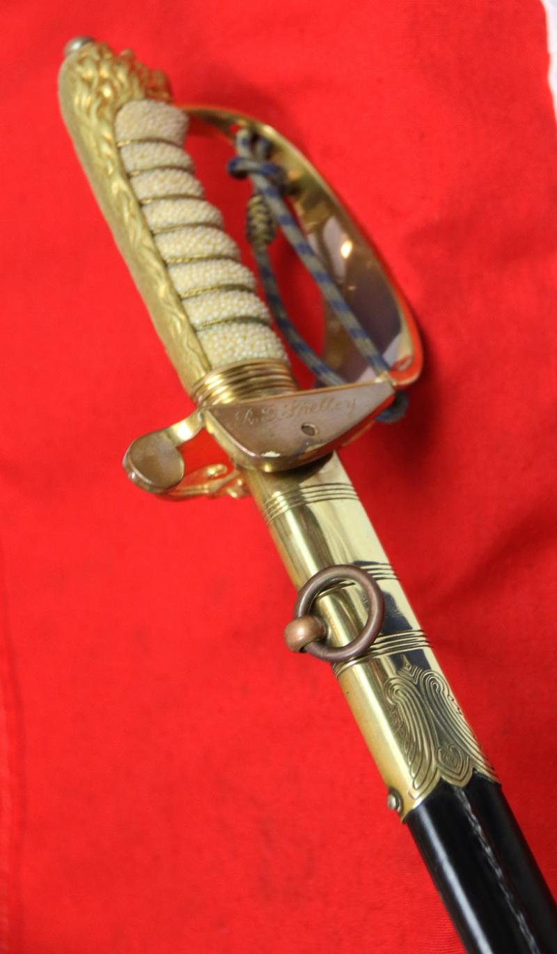 A Near Mint British Royal Naval Offcer's Sword King George VIth Hilt and Mounts With The Upgraded Wilkinson Sword 1952-53 Deluxe Elizabeth IInd Coronation Blade, Of Mirror Bright & Frosted Polish. With Original Geo VIth Sword Knot — image 8