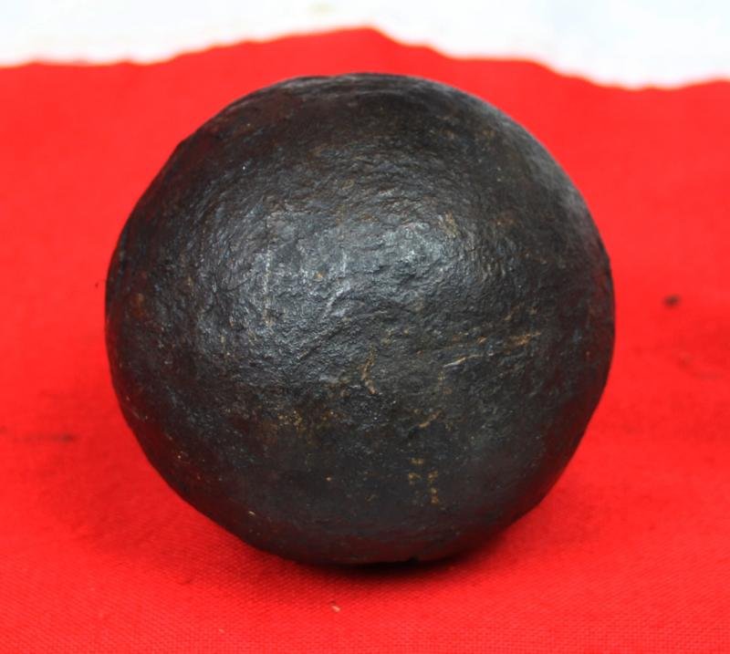 A Superb Original Waterloo Recovered Souvenir '6 Pounder ' Royal Artillery Cannon Ball Fired at La Haye Sainte During The Battle, Recovered From The Farm. With Clear impact Site To The Ball.
