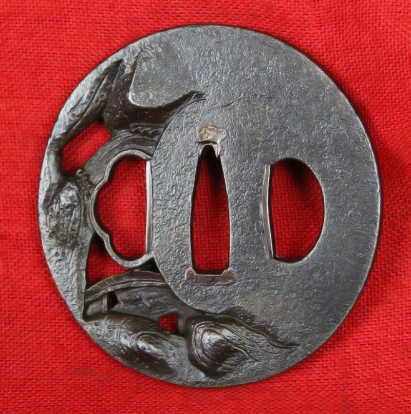 A Fine & Beautiful Edo Period Iron Tsuba in Nikubori Jisukashi Of Waterfalls Rocks and River with A wooden Bridge Being Traversed by a Figure On Horseback Carrying a Parasol — image 2